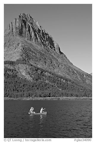 Red canoe on Swiftcurrent Lake. Glacier National Park, Montana, USA.