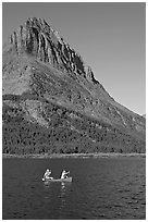 Red canoe on Swiftcurrent Lake. Glacier National Park, Montana, USA. (black and white)