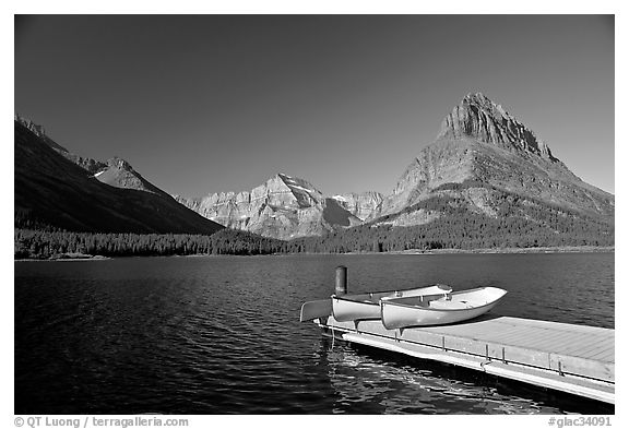 Deck and small boats on Swiftcurrent Lake. Glacier National Park, Montana, USA.