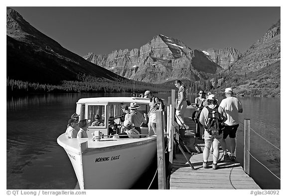 Passengers embarking on tour boat at the end of Lake Josephine. Glacier National Park, Montana, USA.