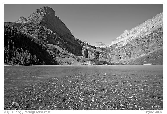 Pebbles in Grinnell Lake, Angel Wing, and the Garden Wall. Glacier National Park, Montana, USA.