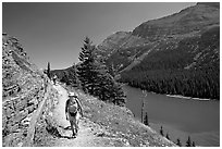 Hikers on trail above Lake Josephine. Glacier National Park, Montana, USA. (black and white)