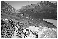 Women hiking on the Grinnell Glacier trail. Glacier National Park, Montana, USA. (black and white)