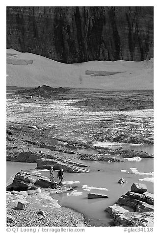 Crossing the outlet stream of the Grinnell glacial lake. Glacier National Park (black and white)