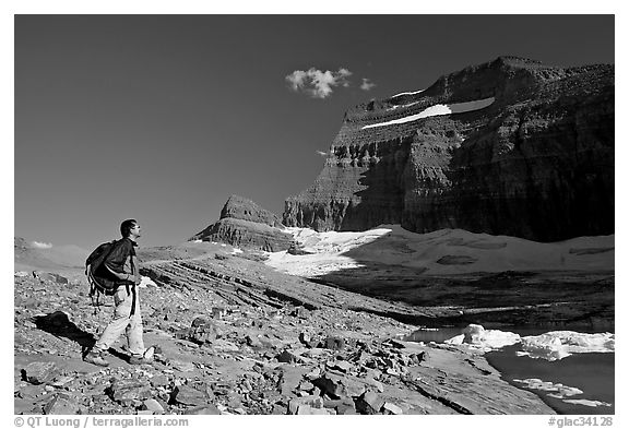 Hiker on moraine near Grinnell Glacier. Glacier National Park, Montana, USA.