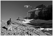 Hiker on moraine near Grinnell Glacier. Glacier National Park, Montana, USA. (black and white)