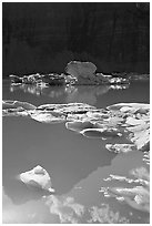 Garden wall reflection and icebergs in Upper Grinnell Lake. Glacier National Park, Montana, USA. (black and white)