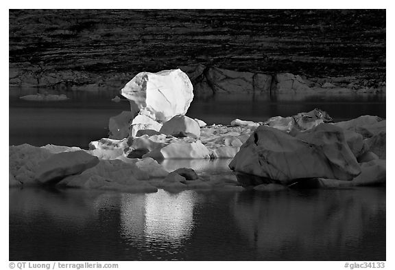 Last light on an iceberg in Upper Grinnell Lake. Glacier National Park, Montana, USA.