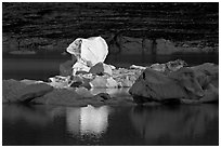 Last light on an iceberg in Upper Grinnell Lake. Glacier National Park, Montana, USA. (black and white)