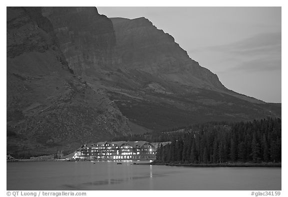 Swiftcurrent Lake and Many Glacier Lodge lights at dusk. Glacier National Park, Montana, USA.