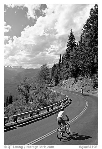 Bicyclists riding down Going-to-the-Sun road. Glacier National Park, Montana, USA.