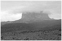 Chief Mountain, with top in the clouds. Glacier National Park, Montana, USA. (black and white)