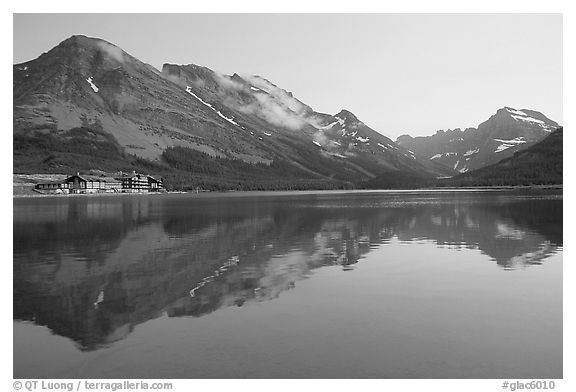 Many Glacier Hotel reflected in Swiftcurrent Lake. Glacier National Park, Montana, USA.