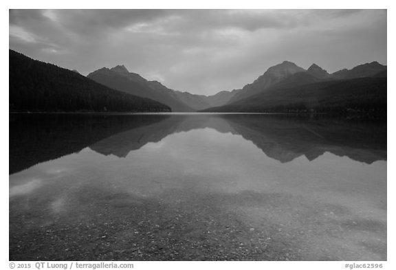 Reflections and pebbles at dawn, Bowman Lake. Glacier National Park (black and white)