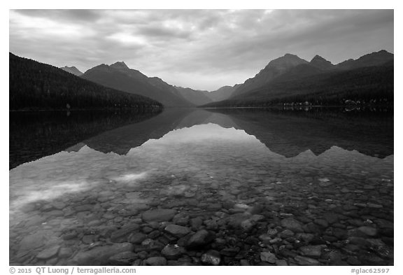 Submerged rocks and mountain reflected, Bowman Lake. Glacier National Park (black and white)