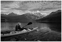 Kayaker paddles away from shore, Kintla Lake. Glacier National Park ( black and white)