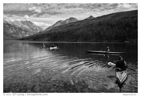 Four kayakers on Kintla Lake. Glacier National Park (black and white)