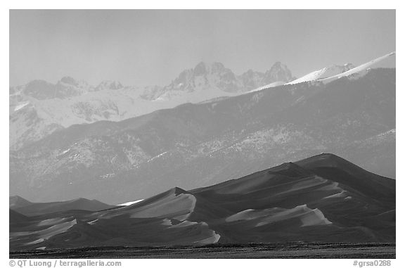 Distant view of the dune field and Sangre de Christo mountains at sunset. Great Sand Dunes National Park, Colorado, USA.