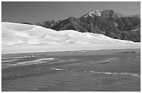 Mendonca creek, dunes and Sangre de Christo mountains. Great Sand Dunes National Park, Colorado, USA. (black and white)