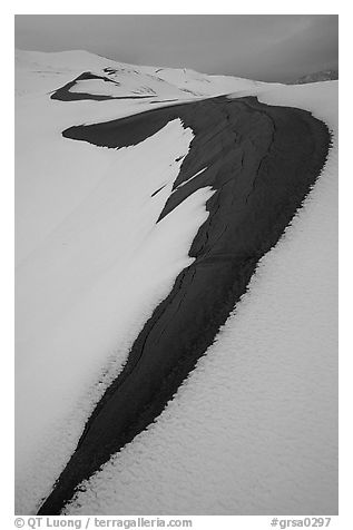 Curve on snowy dunes. Great Sand Dunes National Park and Preserve (black and white)