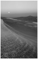 Dunes at dawn with snow and moon. Great Sand Dunes National Park, Colorado, USA. (black and white)