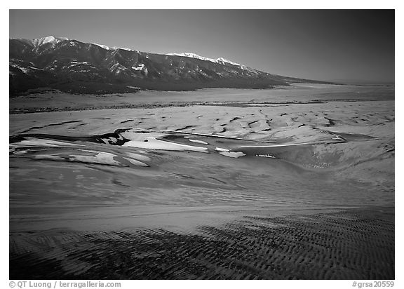 Sand dunes with patches of snow seen from above. Great Sand Dunes National Park, Colorado, USA.