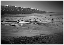 Sand dunes with patches of snow seen from above. Great Sand Dunes National Park, Colorado, USA. (black and white)