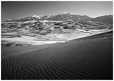 Rippled dunes and Sangre de Christo mountains in winter. Great Sand Dunes National Park, Colorado, USA. (black and white)