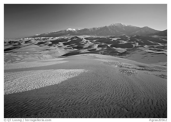 Sand dunes with snow patches and Sangre de Christo range. Great Sand Dunes National Park, Colorado, USA.