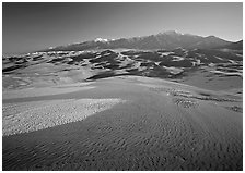 Sand dunes with snow patches and Sangre de Christo range. Great Sand Dunes National Park, Colorado, USA. (black and white)