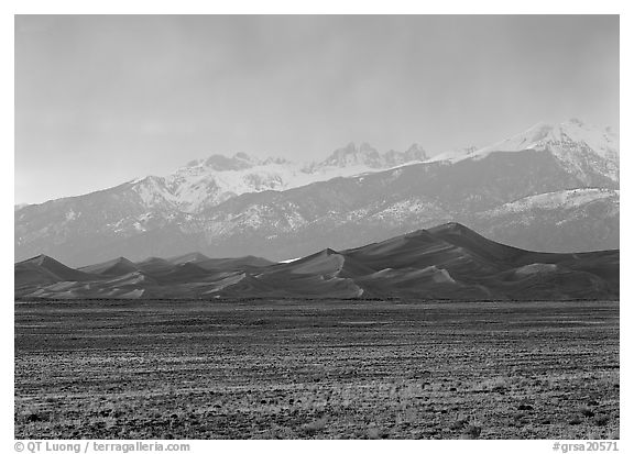 Flats, sand dunes, and snowy Sangre de Christo mountains. Great Sand Dunes National Park, Colorado, USA.