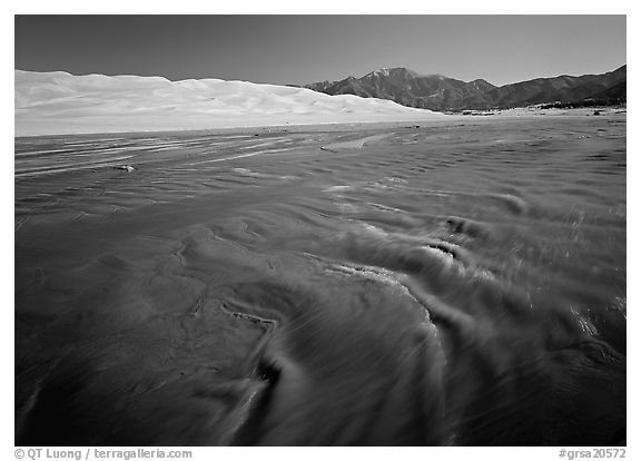 Medano creek with shifting sands, dunes and Sangre de Christo mountains. Great Sand Dunes National Park and Preserve (black and white)