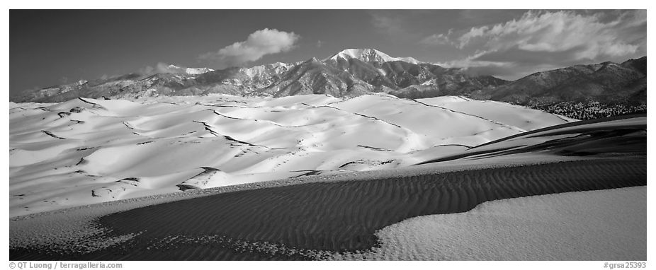 Landscape of snowy dunes and mountains. Great Sand Dunes National Park (black and white)