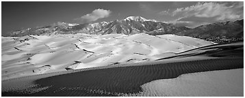 Landscape of snowy dunes and mountains. Great Sand Dunes National Park (Panoramic black and white)