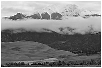 Dunes and Medano creek below snowy mountains. Great Sand Dunes National Park and Preserve ( black and white)