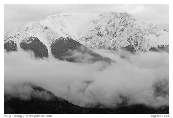 Snowy Sangre de Cristo Mountains above clouds. Great Sand Dunes National Park, Colorado, USA.