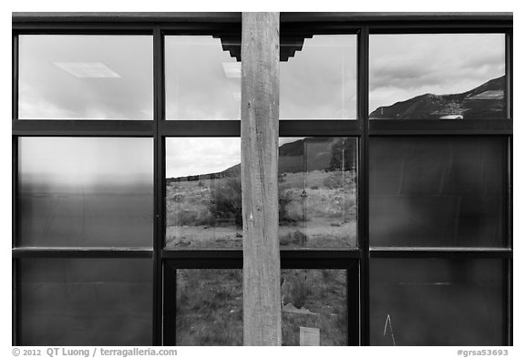 Grasslands and mountains, visitor center window reflexion. Great Sand Dunes National Park, Colorado, USA.