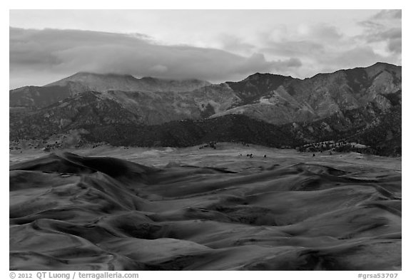 Dunes and mountains with fall colors at dusk. Great Sand Dunes National Park and Preserve (black and white)