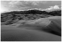 Dunes and Sangre de Cristo mountains at dusk. Great Sand Dunes National Park, Colorado, USA. (black and white)