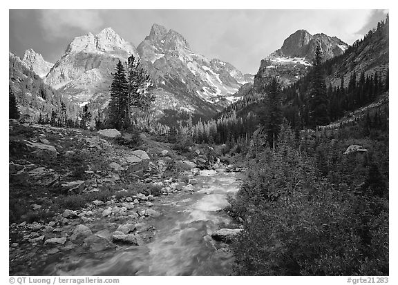 Valley, Cascade creek and Teton range with storm light. Grand Teton National Park, Wyoming, USA.