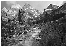 Valley, Cascade creek and Teton range with storm light. Grand Teton National Park ( black and white)