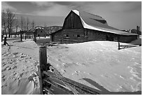 Historic Mormon Row homestead in winter. Grand Teton National Park, Wyoming, USA. (black and white)