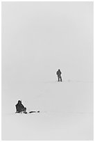 Ice fishermen on Frozen Jackson Lake. Grand Teton National Park, Wyoming, USA. (black and white)