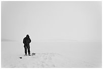 Ice fishing on Jackson Lake. Grand Teton National Park, Wyoming, USA. (black and white)