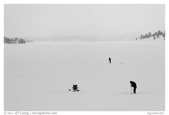 Jackson Lake in winter with ice fishermen. Grand Teton National Park, Wyoming, USA.