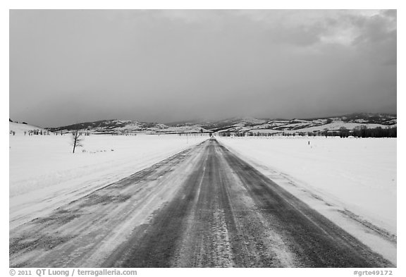 Road in winter at dusk, Gross Ventre valley. Grand Teton National Park, Wyoming, USA.