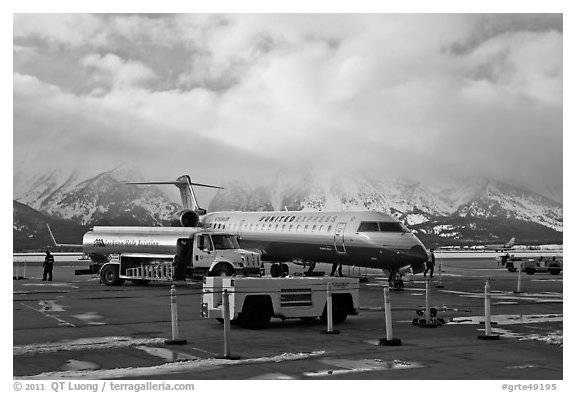 Regional jet and fuel truck, Jackson Hole Airport. Grand Teton National Park, Wyoming, USA.