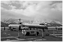 Regional jet and fuel truck, Jackson Hole Airport. Grand Teton National Park, Wyoming, USA. (black and white)