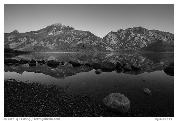 Teton Range reflected in Jenny Lake at sunrise. Grand Teton National Park (black and white)