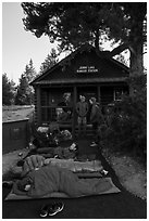 Outdoorsmen camping out in front of Jenny Lake Ranger Station for permits. Grand Teton National Park ( black and white)